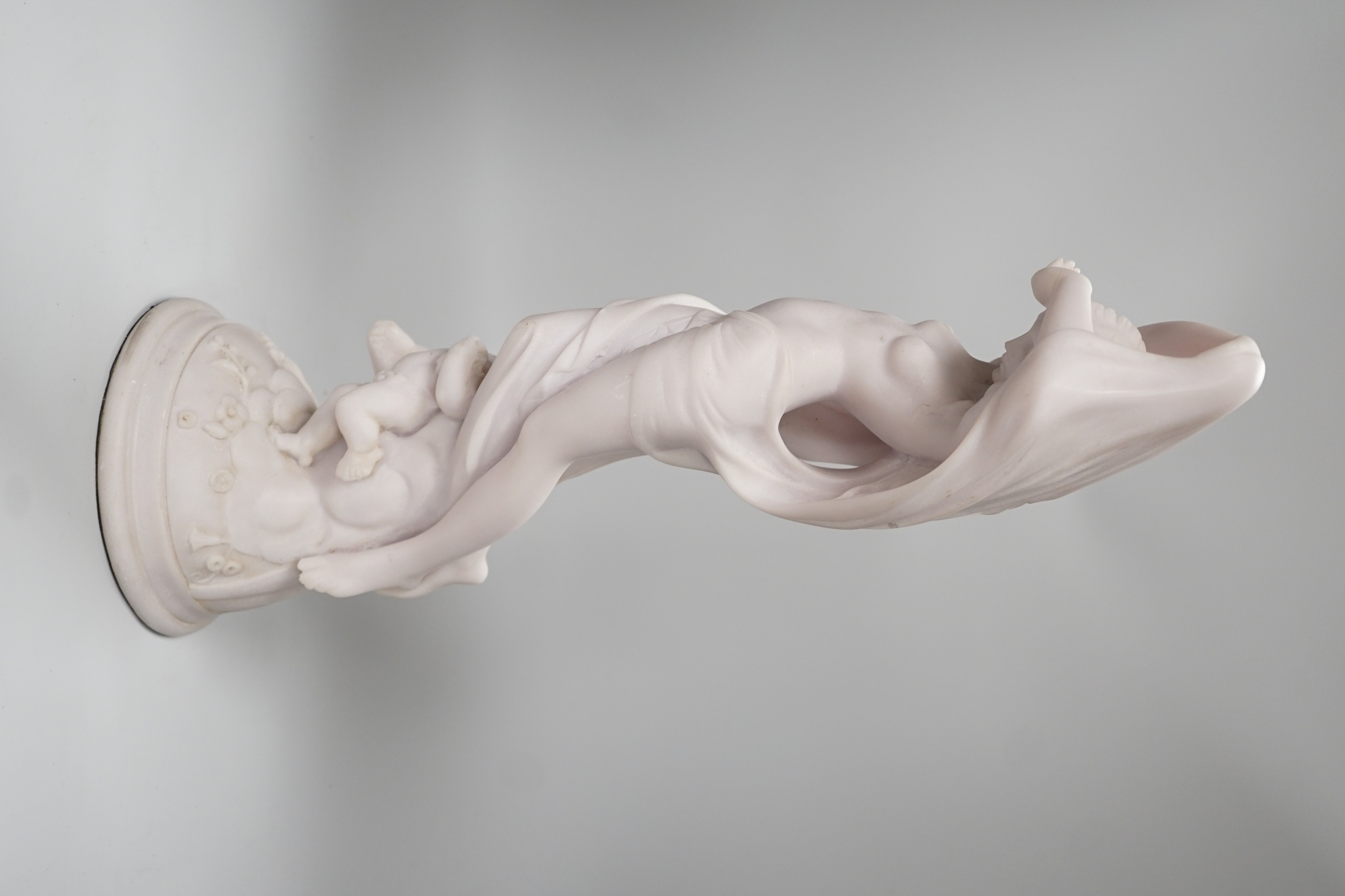 A resin marble figure of Venus and Cupid, 49cm high